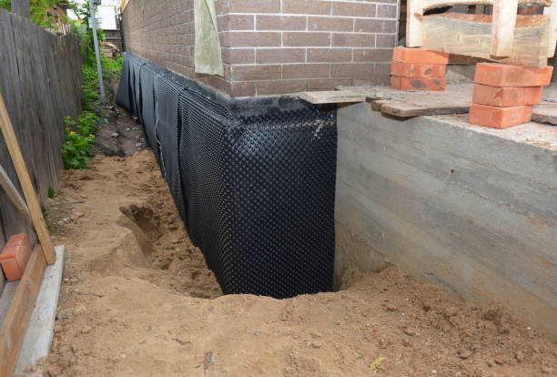 Happy homeowners after waterproofing job in Middle Point